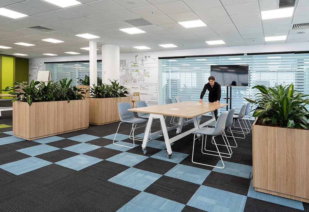 Moving modular office planters and agile office furniture into another position